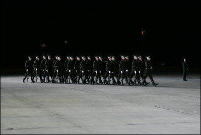 Latvian troops arrive to welcome President and Mrs. George W. Bush to Riga International Airport Friday, May 6, 2005.