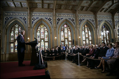 Delivering an address during the 60th anniversary week of WWII, President George W. Bush tells the story of Latvian sailors on eight freighters who disobeyed orders from a puppet government and remained at sea to help the U.S. Merchant Marines during the war at The Small Guild Hall in Riga, Latvia, Saturday, May 7, 2005. “By the end of the war, six of the Latvian ships had been sunk, and more than half the sailors had been lost,” said President Bush. “Nearly all of the survivors settled in America, and became citizens we were proud to call our own.”