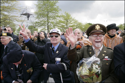 World War II veterans acknowledge President and Mrs. Bush Sunday, May 8, 2005, during a celebration at the Netherlands American Cemetery in Margraten, in remembrance of those who served during World War II.