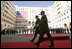 President George W. Bush walks with President Mikhail Saakashvili during an arrival ceremony in the courtyard of the Parliament Building in Tbilisi, Georgia, Tuesday, May 10, 2005.