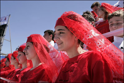 Georgian children in traditional dress join thousands of people gathered in Freedom Square to hear President Bush speak the President's in Tbilisi, Georgia, Tuesday, May 10, 2005. "As you build freedom in this country, you must know that the seeds of liberty you are planting in Georgian soil are flowering across the globe," said President Bush in his remarks." I have come here to thank you for your courage."