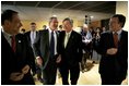 President George W. Bush laughs with, from left, European Union Council Secretariat Javier Solana, European Union President Jean-Claude Juncker and European Commission President Jose Manuel Barroso after a working dinner between the leaders in Brussels Tuesday, Feb. 22, 2005. 