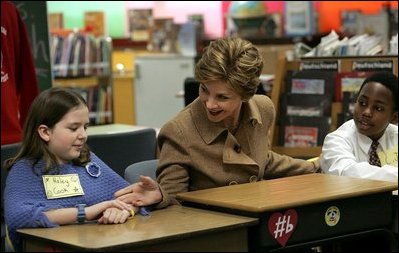 Mrs. Bush greets Hainerberg Elementary School student Hailey Cook during her visit with fourth and fifth graders Tuesday, Feb. 22, 2005 in Wiesbaden, Germany. 