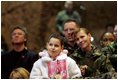 Audience members listen to a speech by Laura Bush praising the sacrifice and hard work of the U.S. military and their families Tuesday, Feb. 22, 2005 at Ramstein Air Base in Ramstein, Germany.