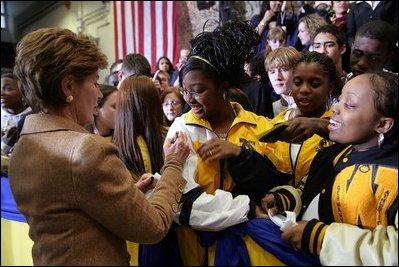 Laura Bush signs autographs for students of General H. H. Arnold High School following her remarks there to students, faculty and parents of the military in Wiesbaden, Germany, Tuesday, Feb. 22, 2005. 