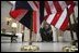 President George W. Bush and Prime Minister Tony Blair of the United Kingdom walk together after addressing the press at the Ambassador's Residence in Brussels, Belgium, Tuesday Feb. 22, 2005. 