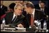 President George W. Bush speaks with European Union High Representative Javier Solana during a plenary session of the North Atlantic Council at NATO Headquarters in Brussels Tuesday, Feb. 22, 2005. 