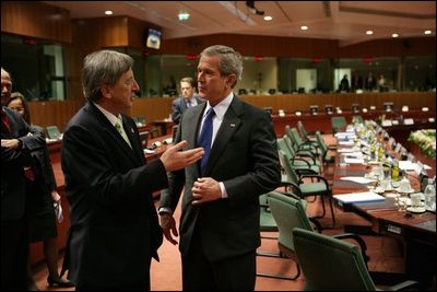 President George W. Bush speaks with European Union President Jean-Claude Juncker after a meeting Tuesday, Feb. 22, 2005, with EU Leaders in Brussels.