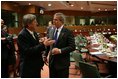 President George W. Bush speaks with European Union President Jean-Claude Juncker after a meeting Tuesday, Feb. 22, 2005, with EU Leaders in Brussels.