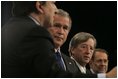 President George W. Bush stands with European Commission President Jose Manuel Barroso, left, European Union President Jean-Claude Juncker and European Union Council Secretariat Javier Solana, right, during a joint news conference Tuesday, Feb. 22, 2005, in Brussels.