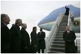 German Chancellor Gerhard Schroeder, fourth from left, and others wait on the tarmac as arriving U.S. President George W. Bush deplanes Air Force One at Rhein-Main Air Base in Frankfurt, Germany.