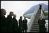 German Chancellor Gerhard Schroeder, fourth from left, and others wait on the tarmac as arriving U.S. President George W. Bush deplanes Air Force One at Rhein-Main Air Base in Frankfurt, Germany.