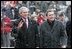 President George W. Bush and German Chancellor Gerhard Schroeder wave to the crowd during an official arrival ceremony at the Electoral Palace in Mainz, Germany, Wednesday, Feb. 23, 2005.