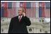 President George Bush listens to Slovak Prime Minister Mikulas Dzurinda's introduction before giving remarks at Hviezdoslavovo Square in Bratislava, Slovakia, Feb. 24, 2005.