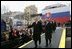 President George W. Bush gives his thumbs up as he leaves the stage with Prime Minister Mikulas Dzurinda of Slovakia after speaking at Hviezdoslavovo Square in Bratislava, Slovak Republic, Thursday, Feb. 24, 2005.