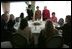 Mrs. Bush talks with spouses of deployed military during a luncheon Tuesday, Feb. 22, 2005, at Ramstein Air Base in Ramstein, Germany.