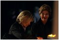 Laura Bush and Mrs. Schroeder-Koepf light candles during a tour of Saint Martin's Cathedral in Mainz, Germany, Feb. 23, 2005. 