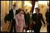 Laura Bush walks with Queen Paola of Belgium during a tour of the Royal Palace of Belgium in Brussels Monday, Feb. 21, 2005.