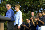 President George W. Bush and Mrs. Bush announce the Healthier US initiative on the South Lawn of the White House June 20. As part of the initiative, President Bush signed two executive orders and named Footba ll Hall of Famer Lynn Swann as Chair and Olympic Gold Medalist in Softball Dot Richardson as Vice Chair to the President's Cou ncil on Physical Fitness.