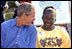 Touring the exhibits, President Bush takes a few moments to visit with children at the hiking/outdoor activity exhibit. 