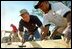 President George W. Bush works on a Habitat For Humanity house in Tampa, Fl., Tuesday, June 5, 2002. 