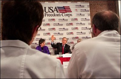 President George W. Bush talks with local police, fire, health and government officials during a roundtable meeting at the Center for Community Safety at Winston-Salem State University, Wednesday, Jan 30, 2002. 