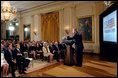 President George W. Bush celebrates the 6-month anniversary of USA Freedom Corps by unveiling a new public service announcement in the East Room July 30. "The USA Freedom Corps is matching potential volunteers with local charities," said the President. "We're promoting service to prepare for crises at home, to strengthen our communities, to help people in need, and to extend American compassion throughout the world." 