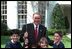 President George W. Bush meets with youth volunteers on the South Lawn of the White House. 