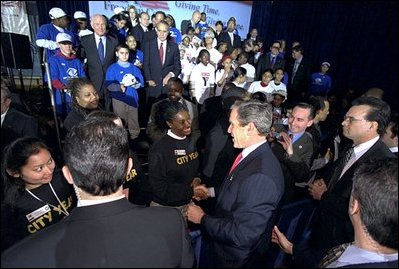 On the first anniversary of President Bush's USA Freedom Corps initiative, the President visits the Jelleff Branch of the Boys & Girls Club of Greater Washington, D.C., Jan. 30. "Once again, I'm asking our fellow citizens to serve your community and to serve your country by finding a program that will make a difference in somebody's lives. It doesn't matter how big or small the program may sound. What matters is your love and your energy and your participation," said the President.