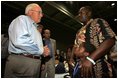 Vice President Dick Cheney visits with families who have been relocated from their homes in Louisiana and Mississippi to the Austin Convention Center in Austin, Texas Saturday, September 10, 2005. The Convention Center has been designated as one of the many temporary shelters for Katrina Hurricane evacuees. 