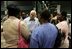 Vice President Dick Cheney visits with families who have been relocated from their homes in Louisiana and Mississippi to the Austin Convention Center in Austin, Texas Saturday, September 10, 2005. The Convention Center has been designated as one of the many temporary shelters for Katrina Hurricane evacuees. 