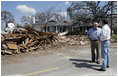 Vice President Dick Cheney talks with Mayor Greg Warr as they take a walking tour of a Gulfport, Mississippi neighborhood which was damaged recently by Hurricane Katrina Thursday, September 8, 2005.