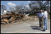 Vice President Dick Cheney talks with Mayor Greg Warr as they take a walking tour of a Gulfport, Mississippi neighborhood which was damaged recently by Hurricane Katrina Thursday, September 8, 2005.