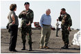 Vice President Dick Cheney and Governor Kathleen Blanco talk with members of the US Army Corp of Engineers during a tour of the 17th street levee repair operations in New Orleans, Louisiana Thursday, September 8, 2005. The Vice President's tour of the city includes visits with police and EMS personnel working in the area.