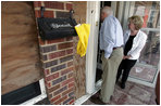 Vice President Dick Cheney and Mrs. Cheney survey damages in one Gulf Shore, Mississippi home Thursday, September 8, 2005, during a walking tour of a neighborhood that was damaged recently by Hurricane Katrina.