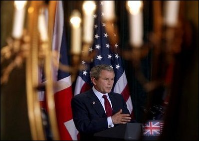 President George W. Bush is reflected in a mirror during a press conference with British Prime Minister Tony Blair at Hillsborough Castle near Belfast, Northern Ireland, Tuesday, April 8, 2003. White House photo by Paul Morse