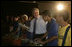 President George W. Bush joins youthful musicians during a visit Friday, March 9, 2007, to Meninos do Morumbi in Sao Paulo. White House photo by Eric Draper