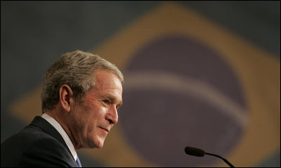 President George W. Bush listens to Brazil’s President Luiz Inacio Lula da Silva during joint press availability Friday, March 9, 2007, in Sao Paulo. White House photo by Paul Morse