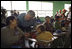 President George W. Bush visits with a villager at the Medical Readiness and Training Exercise Site at the Carlos Emilio Leonard School during a visit Monday, March 12, 2007, in Santa Cruz Balanya, Guatemala. White House photo by Eric Draper