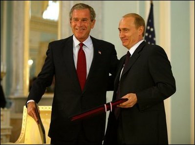 President George W. Bush and Russian President Vladimir Putin after exchanging documents of ratification inside the Konstantin Palace after a private meeting in St. Petersburg, Russia, June 1, 2003.