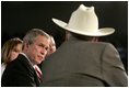 President George W. Bush listens to retired senior citizen Leo Keller during a Town Hall meeting about the strengthening of Social Security at the Montana ExpoPark in Great Falls, Mont., Thursday, Feb. 3, 2005.