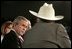 President George W. Bush listens to retired senior citizen Leo Keller during a Town Hall meeting about the strengthening of Social Security at the Montana ExpoPark in Great Falls, Mont., Thursday, Feb. 3, 2005.