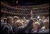 President George W. Bush waves to people in the balconies after participating in a conversation on strengthening Social Security at the Cannon Center for the Performing Arts in Memphis, Tenn., Friday, March 11, 2005.