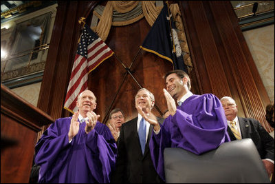 President George W. Bush is greeted to applause as he prepares to address legislators about Social Security at the State House in Columbia, S.C., Monday, April 18, 2005.