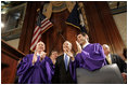 President George W. Bush is greeted to applause as he prepares to address legislators about Social Security at the State House in Columbia, S.C., Monday, April 18, 2005.