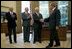 President George W. Bush welcomes Apollo 11 Astronauts Michael Collins, left, Neil Armstrong, center, and Buzz Aldrin to the Oval Office Wednesday, July 21, 2004. The astronauts visited the White House to mark the 35th anniversary of the successful Apollo 11 mission of landing on the moon, walking along its surface and safely returning home.