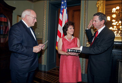 Vice President Dick Cheney swears in NASA Administrator Michael Griffin as his wife, Rebecca Griffin, holds the Bible during a ceremony in the Vice President's Ceremonial Office at the Dwight D. Eisenhower Executive Office Building Tuesday, June 28, 2005. Mr. Griffin is the 11th Administrator of the National Aeronautics and Space Administration.