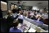 Vice President Dick Cheney listens to a briefing on NASA's Spirit and Opportunity Expeditions to Mars in the Jet Propulsion Laboratory's mission control room in Pasadena, Calif., Jan. 14, 2004. JPL developed and now remotely controls the rover Spirit since it landed on the planet Jan. 3, 2004. Sitting next to Vice President Cheney are, from left, Dr. Frederick D. Gregory, NASA Deputy Administrator, Dr. David Baltimore, President of the California Institute of Technology and Dr. Charles Elachi, the Director of the Jet Propulsion Laboratory.