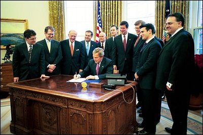 President Bush signs the 21st Century Nanotechnology Research and Development Act in the Oval Office Dec. 3, 2003. Nanotechnology offers the promise of breakthroughs that will revolutionize the way we detect and treat disease, monitor and protect the environment, produce and store energy, and build complex structures as small as an electronic circuit or as large as an airplane. 