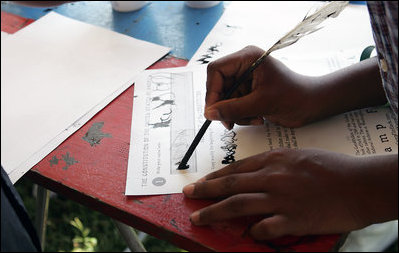 One fourth grader from a local Fairfax County public school tries to write with a quill pen during during a Constitution Day 2005 celebration at George Washington's Mount Vernon Estate Friday, September 16, 2005. Lynne Cheney hosted the celebration which marks the 218th anniversary of the signing of the U.S. Constitution. 